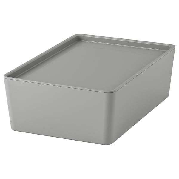 A KUGGIS storage box in grey. Its rectangular, made from recycled pet plastic, and designed for organising desk accessories or media gadgets.