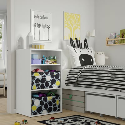 Kids room with LASTARE toy storage, zebra bedding, black/white rug, colourful art, and wooden toy car.