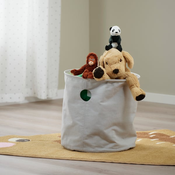 Large fabric storage bin with stuffed animals, ideal for toy organisation and childrens rooms.