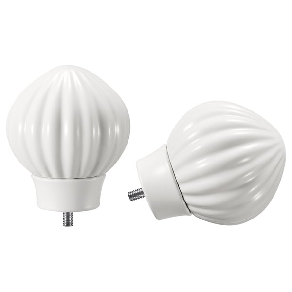 Two white ceramic finials for curtain rods, one showing attached base, featuring a ribbed, rounded shape.