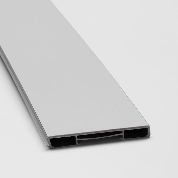 Close-up of smooth, light grey LERHYTTAN kitchen plinth with sleek, bevelled edges and secure clips.