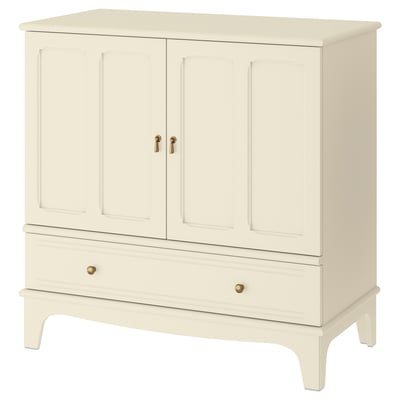 A cream-colored LOMMARP cabinet with two doors, a drawer, and a traditional design, made from durable materials.