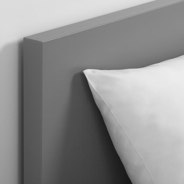 Modern bed headboard in sleek grey finish with smooth texture and clean design.