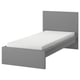 A grey MALM bed with a clean, minimalist design. It has a high headboard, adjustable bed sides, and a foam mattress.