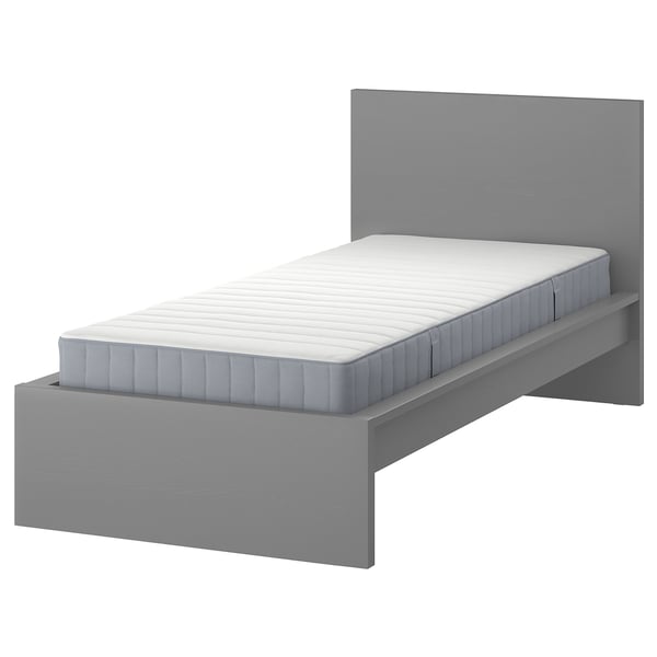 Modern grey MALM bed with sleek headboard and white mattress, minimalist design.