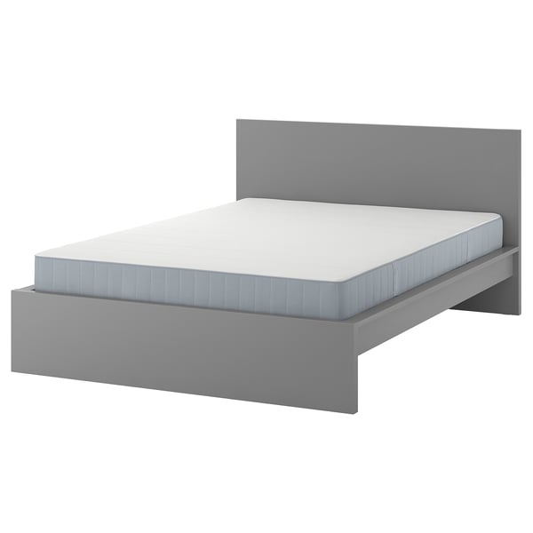 A grey IKEA MALM bed with a light grey mattress, featuring a high headboard and square sides, ideal for modern bedrooms.