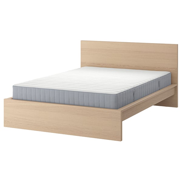 Minimalist light wooden bed with padded grey mattress, sleek headboard.