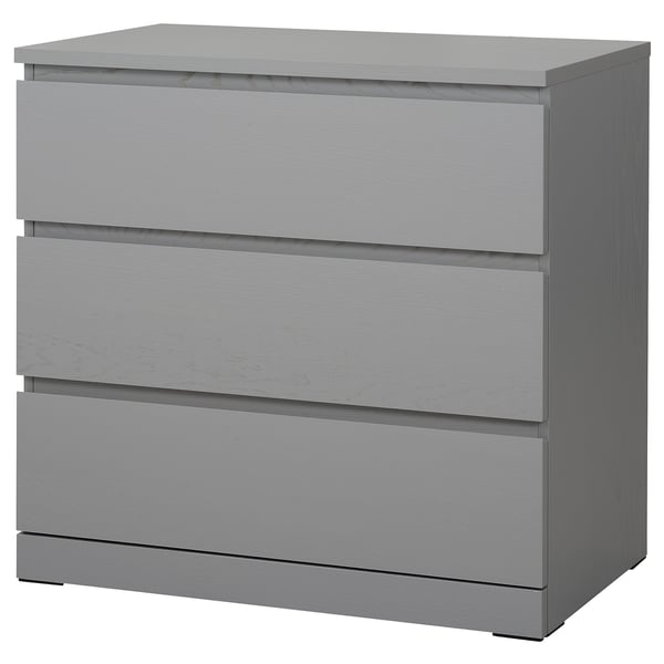 A grey MALM chest of drawers with three drawers. Modern and practical design for bedrooms.