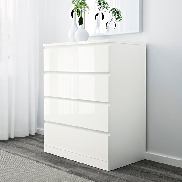 White MALM chest with 4 smooth drawers. Sleek, minimalist design. Safe with wall support.