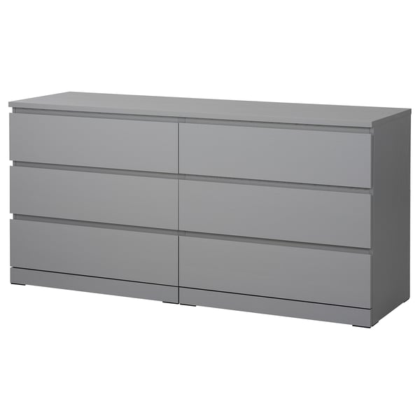 A grey MALM six-drawer chest with a sleek, modern design and smooth-running drawers.