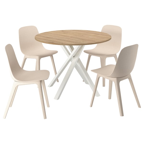 A MARIEDAMM dining set with a light brown round table and four beige chairs, featuring a modern minimalist design with wooden and plastic materials.
