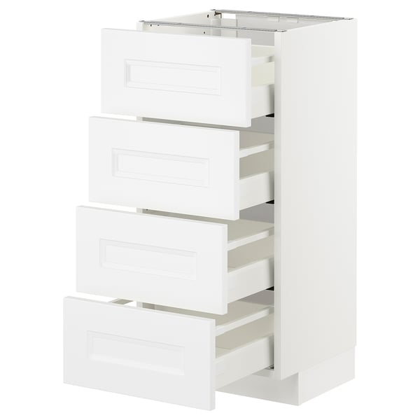 A white METOD kitchen cabinet with four drawers featuring sleek, modern design and smooth-running mechanisms.