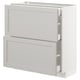 White kitchen cabinet, with two drawers, classic design, part of IKEAs METOD system.
