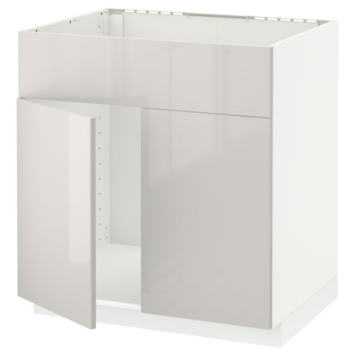 A white METOD kitchen cabinet with a glossy finish. The cabinet is rectangular, designed for a modern kitchen, with clean lines and a minimalist look.