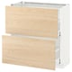 A white METOD kitchen cabinet with light ash wood-patterned drawers, featuring a modern design.