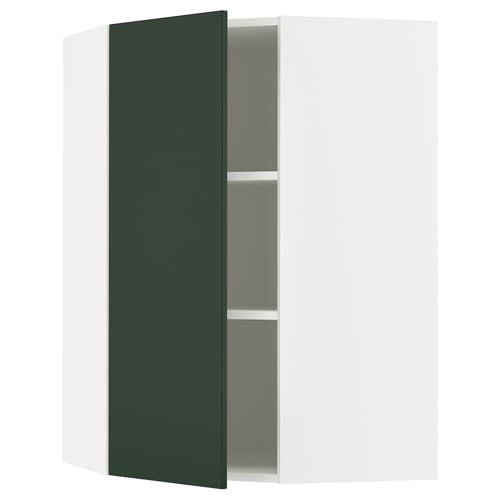 A green cabinet from the METOD kitchen system with one door open, revealing a single adjustable shelf inside.