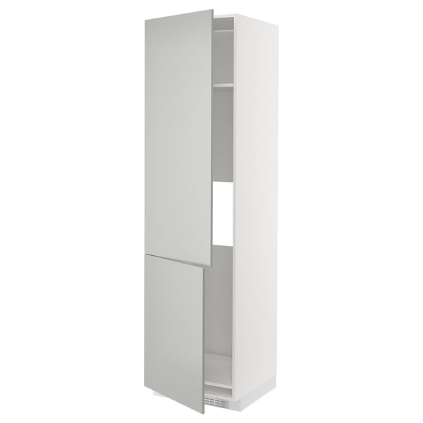 A white, tall, slim kitchen cabinet from the METOD system. It two doors and shelves inside. The cabinet is modern and minimalist in design.