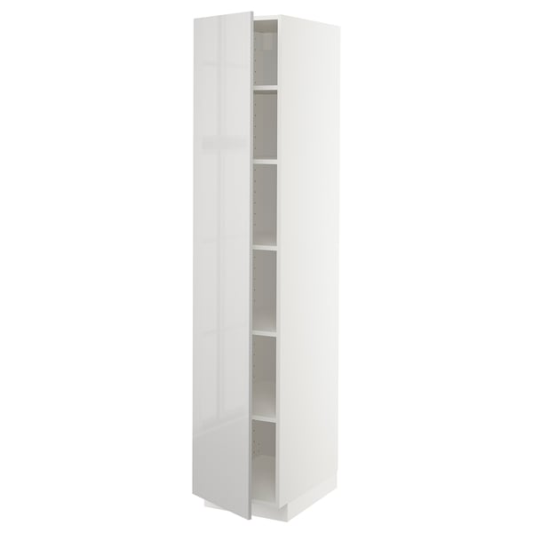 A tall, white METOD kitchen cabinet. It multiple adjustable shelves and a sleek, modern design with high-gloss fronts.