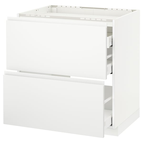 White METOD kitchen unit with drawers and integrated handles.