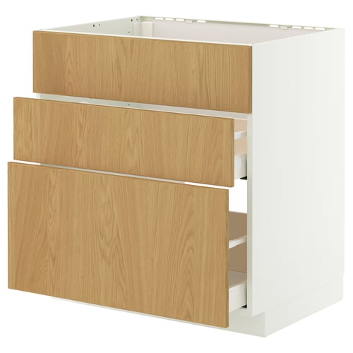A white and light brown wooden kitchen cabinet, featuring three drawers with oak veneer and a smooth surface.