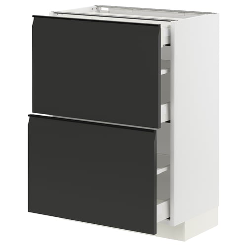 A modern white METOD kitchen cabinet with two matte black drawers featuring integrated handles and angled edges, set against a white background.