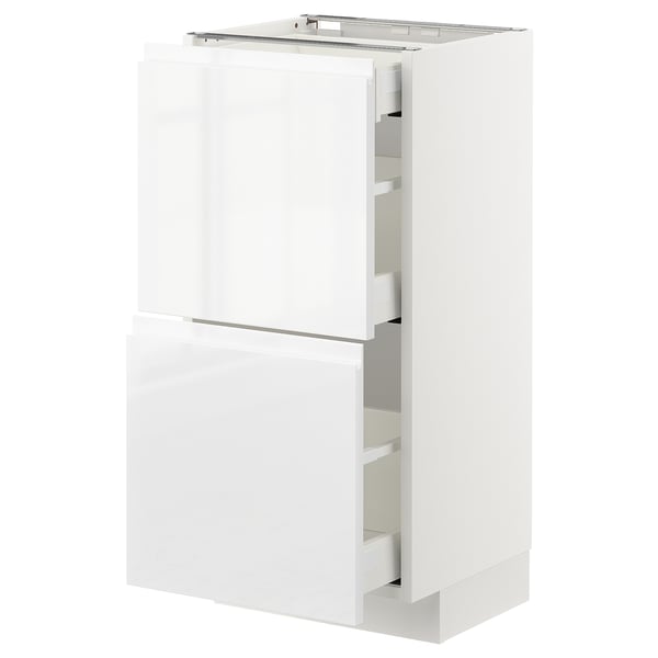 White METOD kitchen cabinet with glossy drawers and doors, sleek modern design.