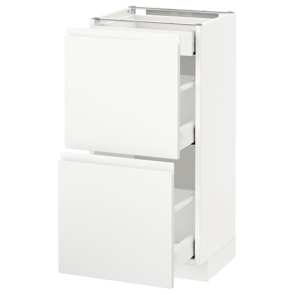 White METOD kitchen cabinet unit with drawers and doors, minimalist design.