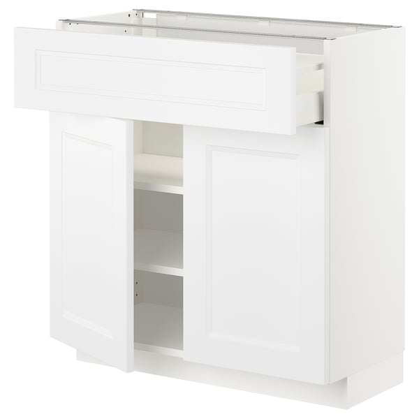 White METOD kitchen unit with drawers and shelves, sleek modern design.