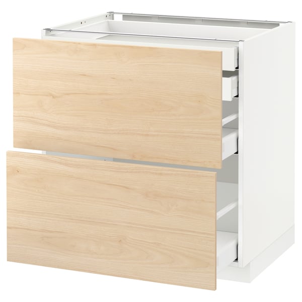 An ikea METOD white and light wood kitchen cabinet set with three drawers.