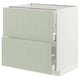 A METOD kitchen unit in green with drawers, sleek edges, and an open drawer on the bottom right.
