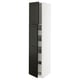 White and black tall kitchen cabinet with bevelled edges and glass shelves.