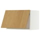An IKEA METOD kitchen cabinet with a light wooden door, featuring a white frame and clean, modern design.