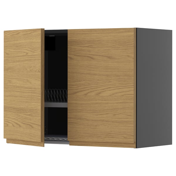 A wooden kitchen cabinet with a grey side. It has oak-style doors and built-in handles, providing a minimalist look with a warm feel.