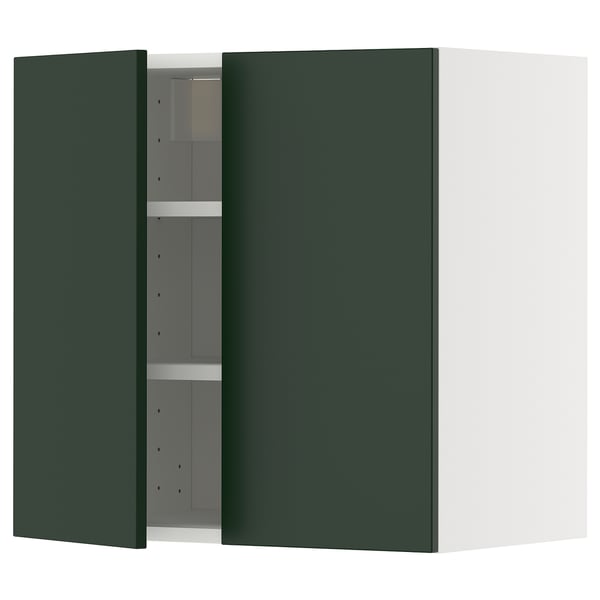 Green cabinet, open showing shelves. Modern minimalist design, metallic hinges.