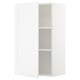 A white METOD kitchen cabinet with a door and adjustable shelf. Its rectangular and a simple, modern design.
