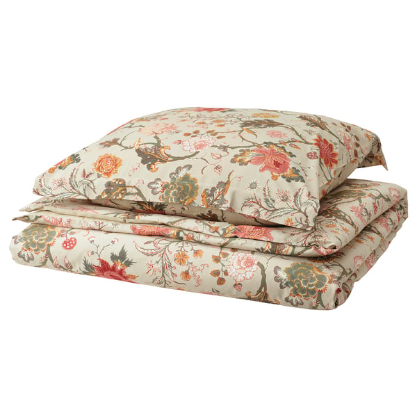 Floral bedding set, cream with multicolor flowers, folded neatly, zip detail.