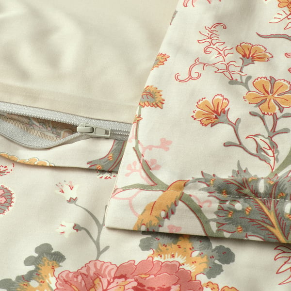 Floral duvet with zip closure, showing reversible pattern and solid side.