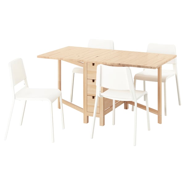 A NORDEN dining set. A light wood table with 6 drawers and 4 white plastic chairs. The table has drop leaves and the chairs are stackable.