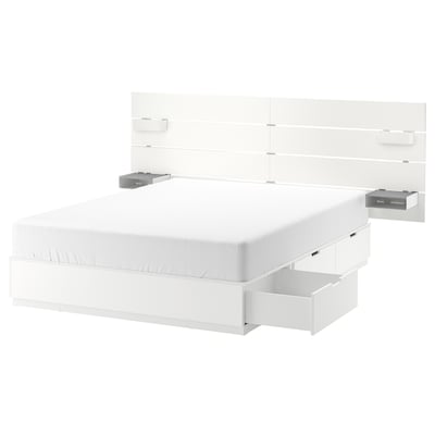 White NORDLI bed, modern design, under-bed drawers, wall-mounted headboard with shelves.
