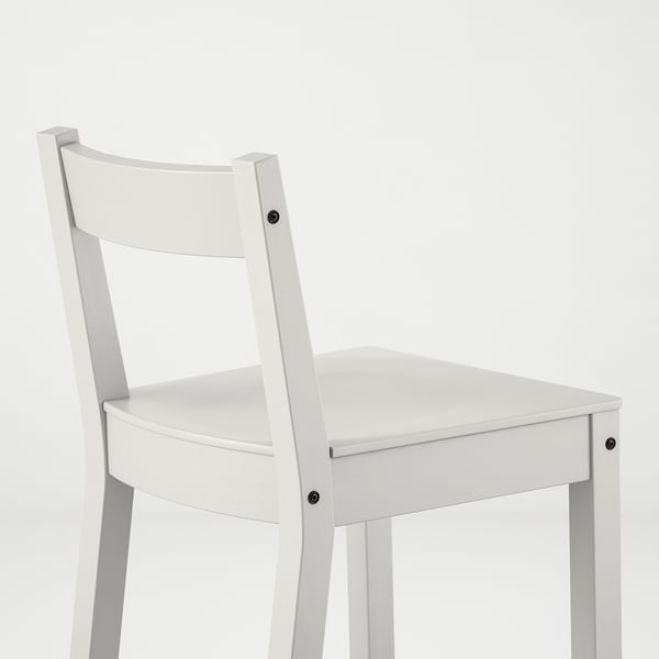 White wooden chair with curved back, sturdy design, smooth finish.