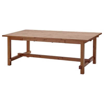 A wooden dining table named NORDVIKEN, rectangular, sturdy, with a smooth, natural finish, and two extension leaves for seating up to eight people.