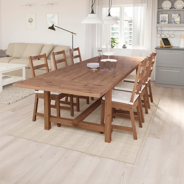 Wooden NORDVIKEN dining table & 6 chairs in modern living space