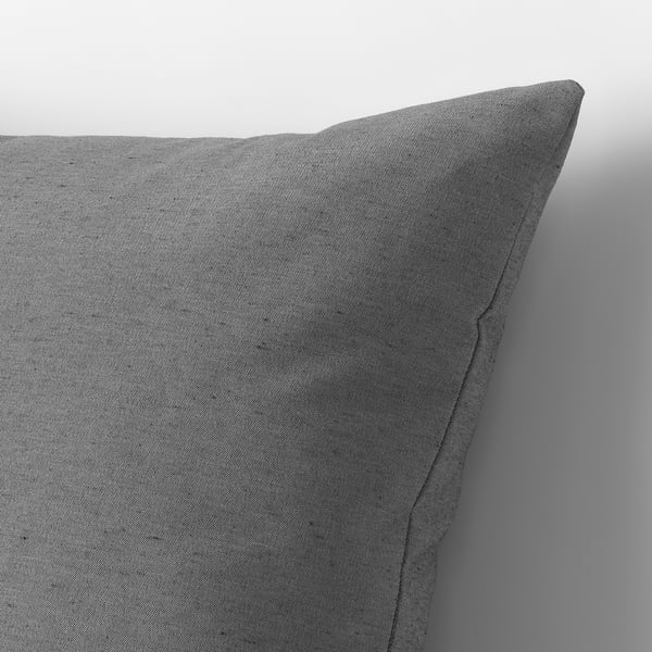 Grey cushion against grey background. High-quality fabric, recycled materials visible in texture.