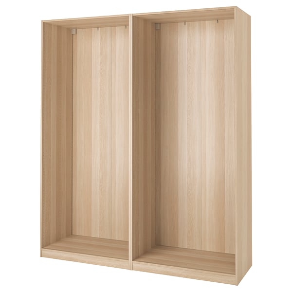 An IKEA PAX wardrobe frame in light oak colour, made of fiberboard and particleboard, rectangular with a modern design.