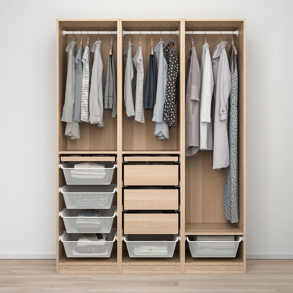Modern closet with clothes, shelves, baskets, and drawers for organised storage.