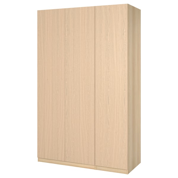 A light-colored wooden wardrobe named PAX. It a simple, rectangular design and three flat panel doors.