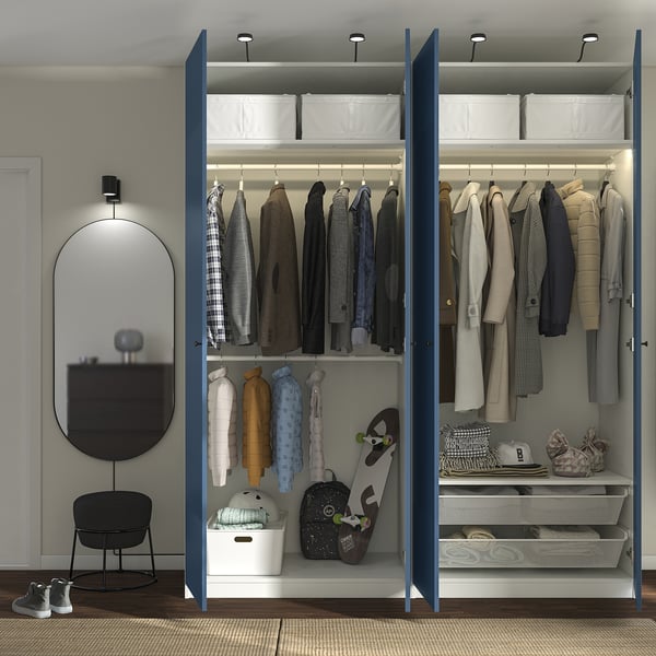 Modern open closet with clothes, bins, bags, and skateboard. Blue frame, adjustable, with slow-closing hinges.