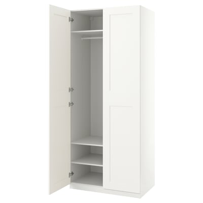 White PAX wardrobe, slim & narrow, open doors revealing shelves & rail, sleek minimalist design.