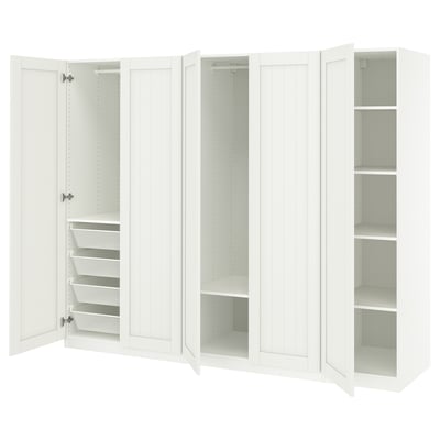 White PAX wardrobe with mesh baskets, adjustable shelves, and soft-closing doors.