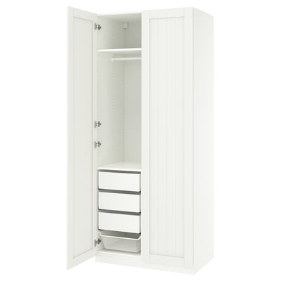 A white PAX wardrobe with two doors, one shelf, three drawers, and a mesh basket.